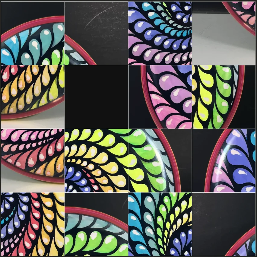 A dyed disc image divided into scrambled sliding-puzzle tiles